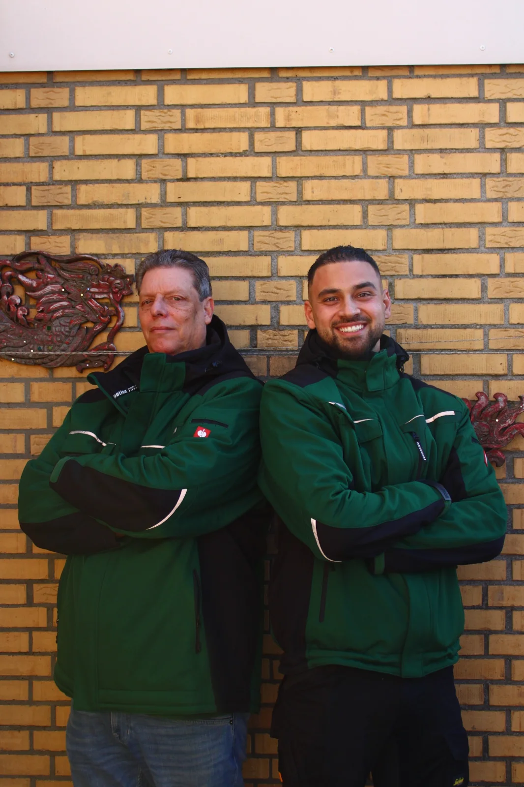 Jordin en Joop in groene bedrijfskleding